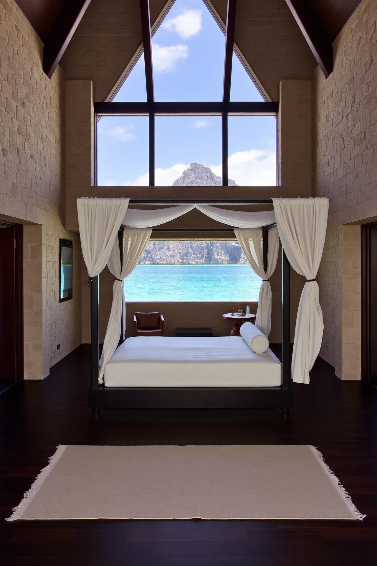 A coral-stone pavilion interior with four-poster bed framing the lagoon and Le Morne mountain